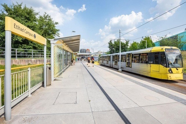 A Manchester tram at the Etihad Campus stop. (TfGM)